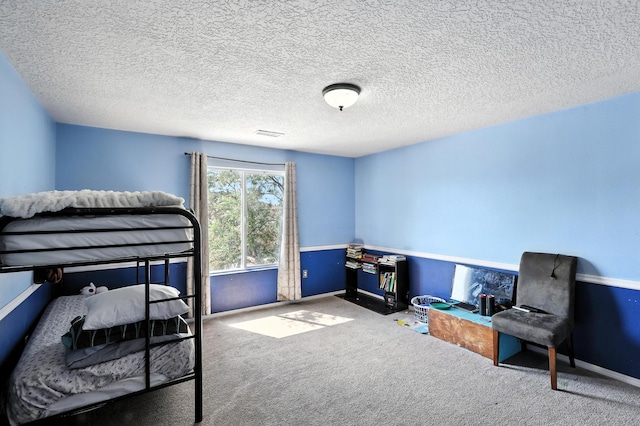 1230 Carrizo St NW, Los Lunas, NM 87031 - bedroom featuring carpet flooring and a textured ceiling