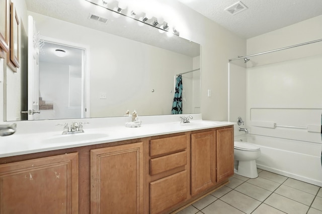 1230 Carrizo St NW, Los Lunas, NM 87031 - full bath featuring double vanity, tile patterned flooring, shower / tub combo with curtain, and a textured ceiling