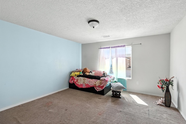 1230 Carrizo St NW, Los Lunas, NM 87031 - bedroom featuring carpet floors and a textured ceiling