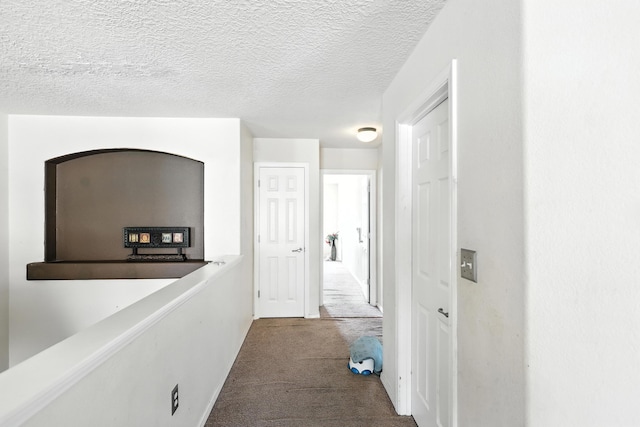 1230 Carrizo St NW, Los Lunas, NM 87031 - hall featuring dark colored carpet