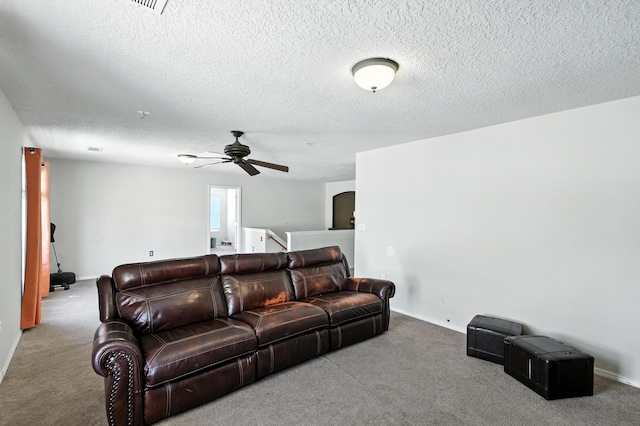 1230 Carrizo St NW, Los Lunas, NM 87031 - carpeted living area with ceiling fan and a textured ceiling