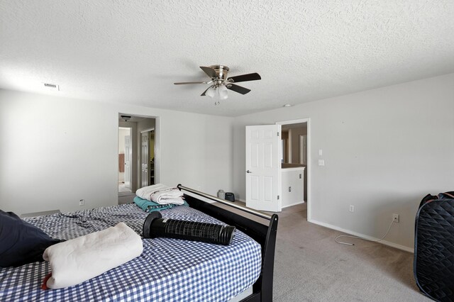 1230 Carrizo St NW, Los Lunas, NM 87031 - carpeted bedroom featuring a ceiling fan and a textured ceiling