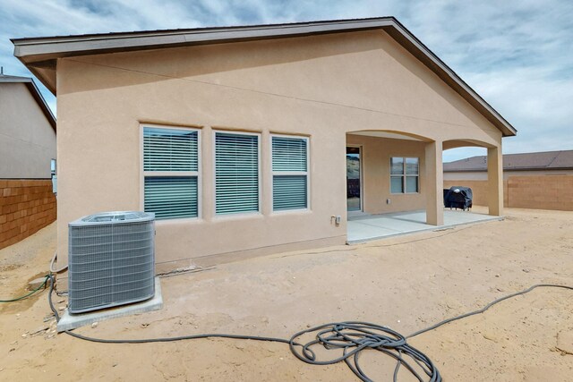 4813 Guadalupe Peak St SW, Los Lunas, NM 87031 - rear view of house featuring a patio area and stucco siding