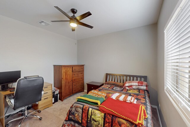 4813 Guadalupe Peak St SW, Los Lunas, NM 87031 - bedroom featuring light colored carpet, an office area, and a ceiling fan