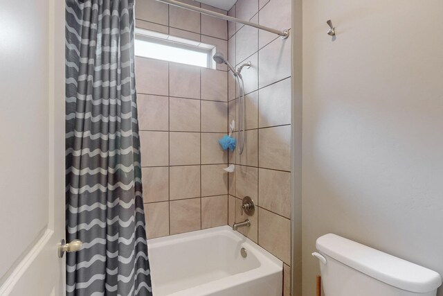 4813 Guadalupe Peak St SW, Los Lunas, NM 87031 - bathroom with shower / bath combination with curtain and toilet