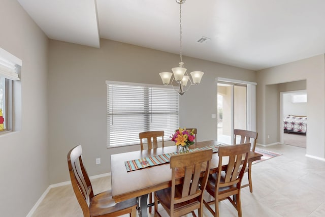 4813 Guadalupe Peak St SW, Los Lunas, NM 87031 - dining space featuring a chandelier and healthy amount of natural light
