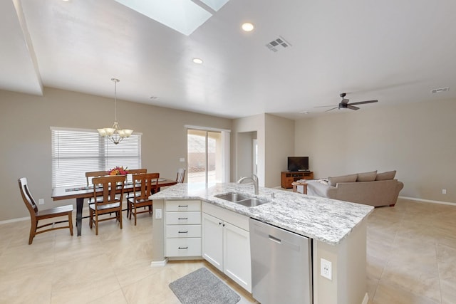 4813 Guadalupe Peak St SW, Los Lunas, NM 87031 - kitchen featuring dishwasher, light tile patterned floors, a chandelier, light stone counters, and recessed lighting