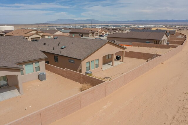 4813 Guadalupe Peak St SW, Los Lunas, NM 87031 - aerial perspective of suburban area with a mountain backdrop
