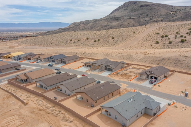 4813 Guadalupe Peak St SW, Los Lunas, NM 87031 - aerial view of property and surrounding area featuring a mountain backdrop and nearby suburban area