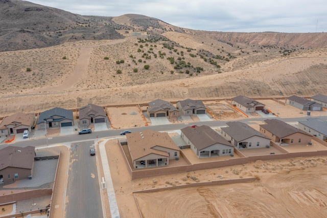 4813 Guadalupe Peak St SW, Los Lunas, NM 87031 - aerial view of property and surrounding area featuring a mountainous background and nearby suburban area