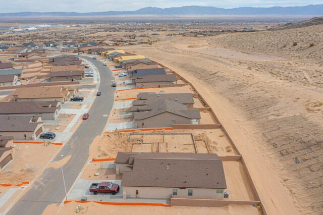4813 Guadalupe Peak St SW, Los Lunas, NM 87031 - aerial view of residential area featuring a mountain backdrop