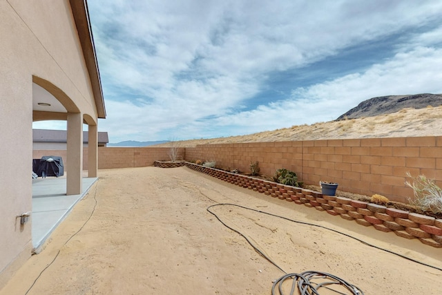 4813 Guadalupe Peak St SW, Los Lunas, NM 87031 - fenced backyard featuring a patio area