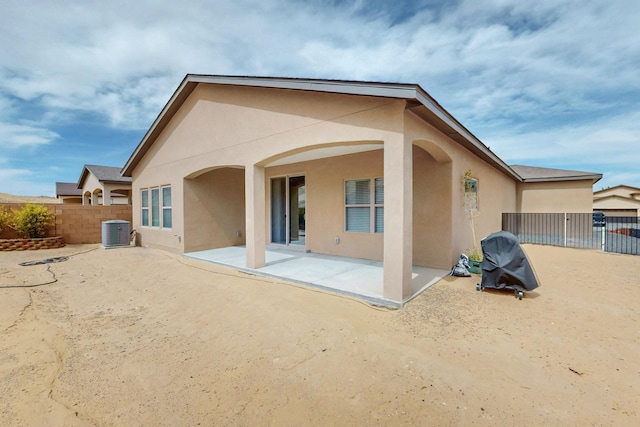 4813 Guadalupe Peak St SW, Los Lunas, NM 87031 - back of property featuring stucco siding and a patio area