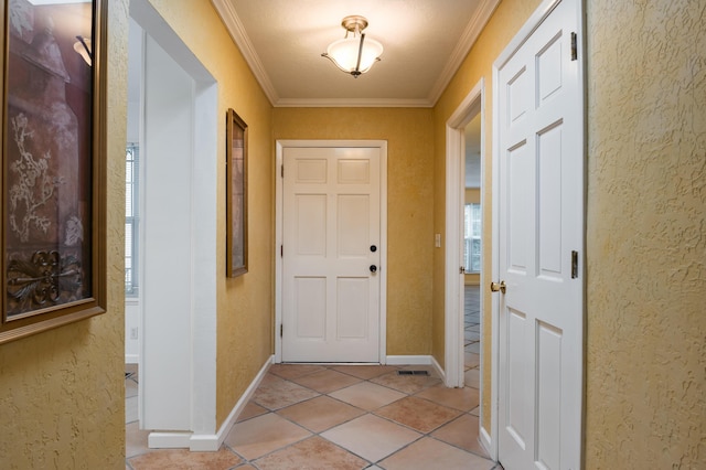 3244 La Ronda Pl NE, Albuquerque, NM 87110 - foyer featuring ornamental molding, light tile patterned flooring, and a textured wall