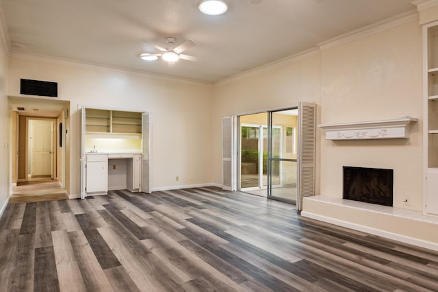 3244 La Ronda Pl NE, Albuquerque, NM 87110 - unfurnished living room with ceiling fan, dark wood finished floors, ornamental molding, and a fireplace with raised hearth