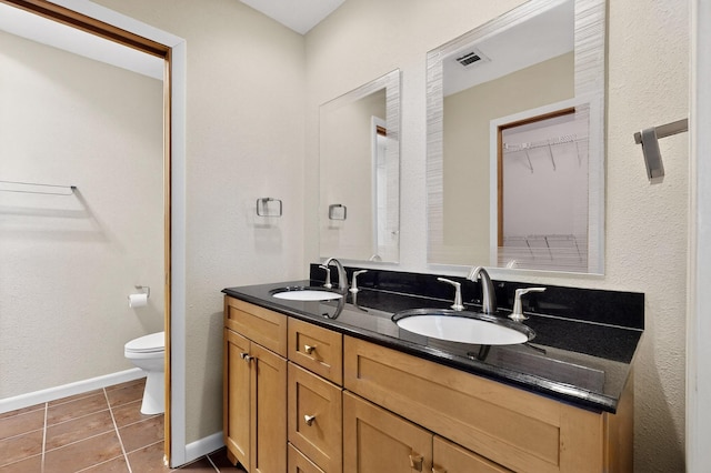 6940 Cherry Hills Loop NE, Albuquerque, NM 87111 - full bathroom featuring double vanity and tile patterned flooring