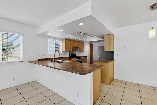 6940 Cherry Hills Loop NE, Albuquerque, NM 87111 - kitchen featuring dark countertops, stainless steel appliances, under cabinet range hood, a peninsula, and light tile patterned flooring