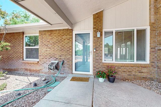 6940 Cherry Hills Loop NE, Albuquerque, NM 87111 - property entrance featuring brick siding and a patio