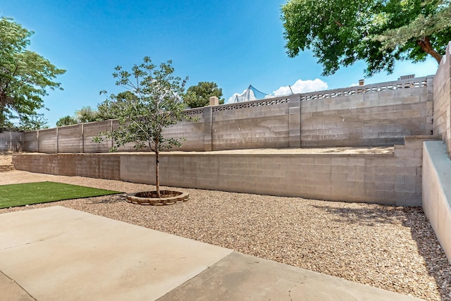 6940 Cherry Hills Loop NE, Albuquerque, NM 87111 - fenced backyard with a patio