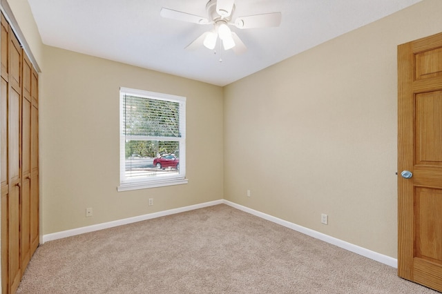 6940 Cherry Hills Loop NE, Albuquerque, NM 87111 - unfurnished bedroom featuring light colored carpet, a closet, and a ceiling fan
