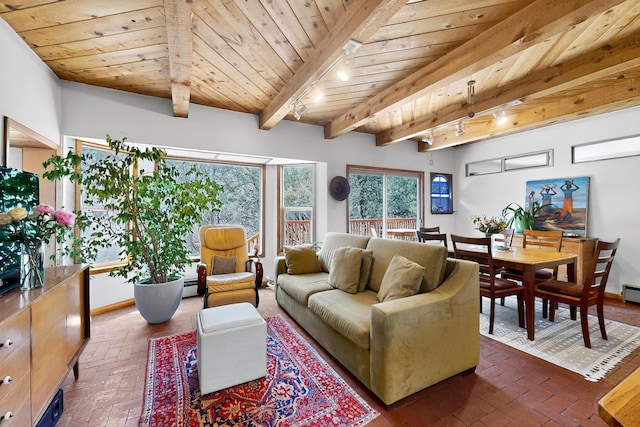 19 Villa Del Monte Loop, Tijeras, NM 87059 - living room with a wooden ceiling with exposed beams, rail lighting, brick flooring, and a baseboard heating unit