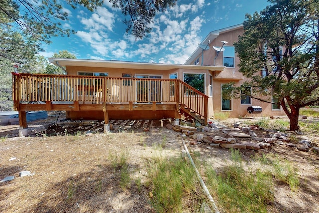 19 Villa Del Monte Loop, Tijeras, NM 87059 - view of front of house with a deck, stairs, and stucco siding