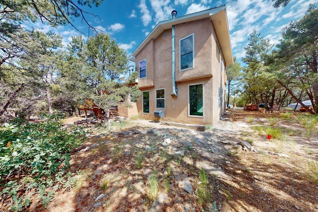 19 Villa Del Monte Loop, Tijeras, NM 87059 - rear view of property with stucco siding