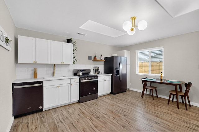 1259 8th St NW, Albuquerque, NM 87102 - kitchen featuring stainless steel appliances, light wood finished floors, light countertops, and tasteful backsplash
