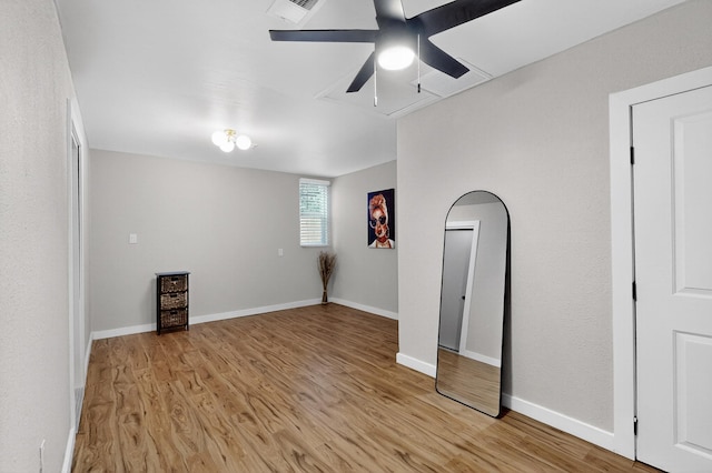 1259 8th St NW, Albuquerque, NM 87102 - spare room with light wood-style flooring, ceiling fan, and attic access