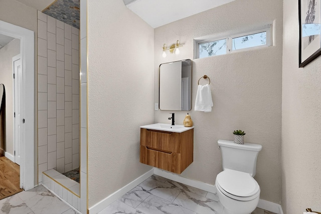 1259 8th St NW, Albuquerque, NM 87102 - full bathroom with marble finish flooring, vanity, a tile shower, and a textured wall