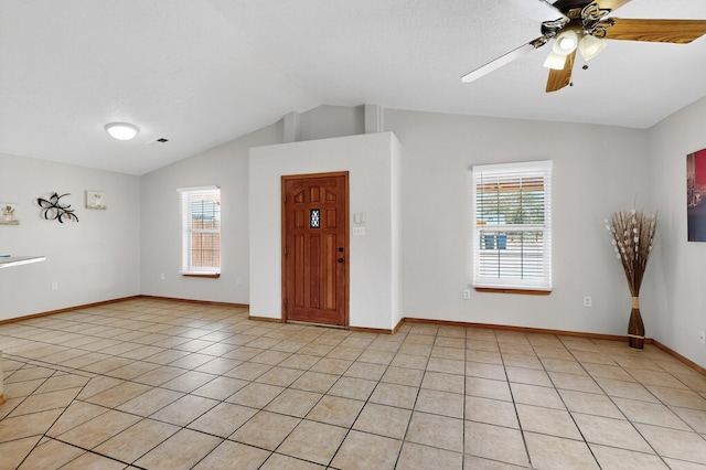 1259 8th St NW, Albuquerque, NM 87102 - foyer featuring plenty of natural light, vaulted ceiling, light tile patterned floors, and ceiling fan