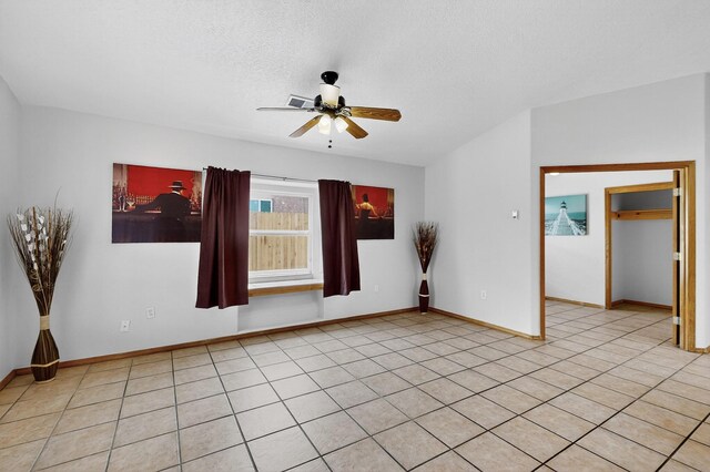 1259 8th St NW, Albuquerque, NM 87102 - spare room featuring a ceiling fan and a textured ceiling