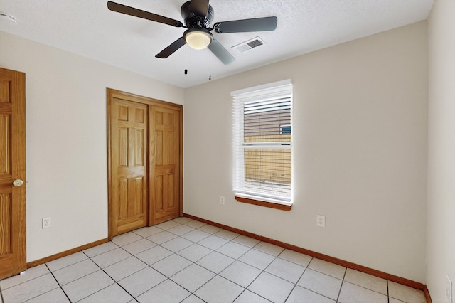 1259 8th St NW, Albuquerque, NM 87102 - unfurnished bedroom featuring a closet and a ceiling fan