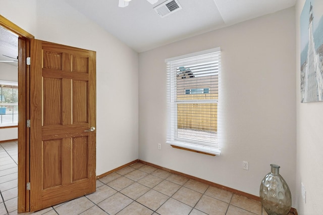 1259 8th St NW, Albuquerque, NM 87102 - empty room featuring lofted ceiling, light tile patterned flooring, and a ceiling fan