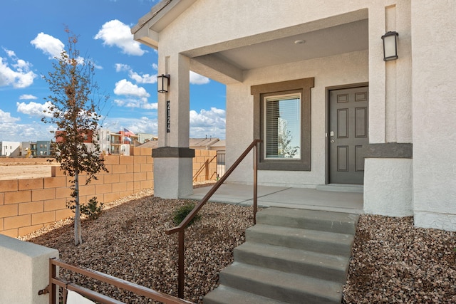 5627 Sagan Loop SE, Albuquerque, NM 87106 - doorway to property with stucco siding