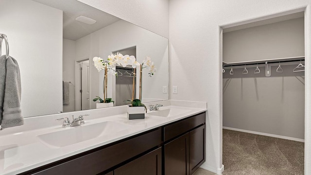5627 Sagan Loop SE, Albuquerque, NM 87106 - bathroom with double vanity and a walk in closet