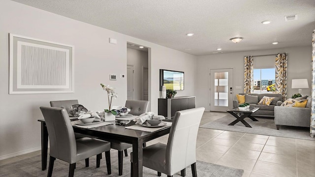 5627 Sagan Loop SE, Albuquerque, NM 87106 - dining area with a textured ceiling, light tile patterned floors, and recessed lighting