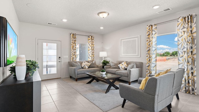 5627 Sagan Loop SE, Albuquerque, NM 87106 - living area with plenty of natural light, light tile patterned floors, a textured ceiling, and recessed lighting
