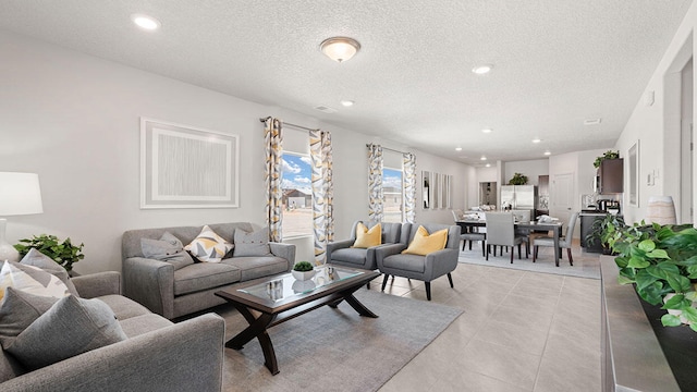 5627 Sagan Loop SE, Albuquerque, NM 87106 - living area featuring a textured ceiling, recessed lighting, and light tile patterned floors