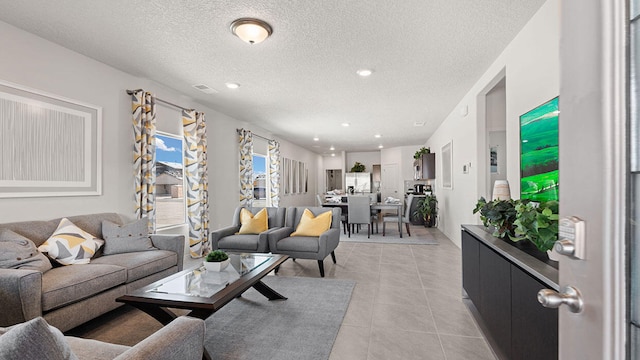 5627 Sagan Loop SE, Albuquerque, NM 87106 - living area with a textured ceiling, light tile patterned floors, and recessed lighting