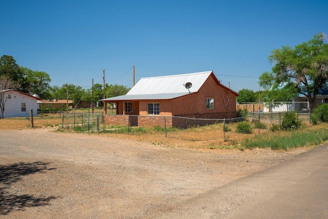 1601 7th St, Moriarty, NM 87035 - view of front facade with a metal roof
