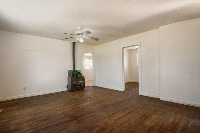 1601 7th St, Moriarty, NM 87035 - spare room featuring dark wood-style flooring, a textured ceiling, and ceiling fan