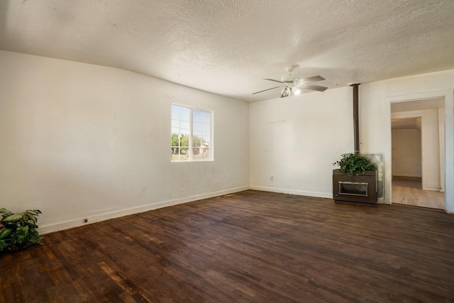 1601 7th St, Moriarty, NM 87035 - empty room featuring dark wood-type flooring, ceiling fan, and a textured ceiling