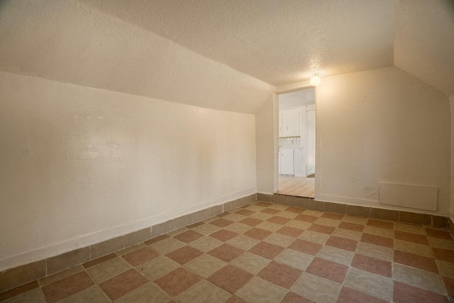 1601 7th St, Moriarty, NM 87035 - bonus room with a textured ceiling and lofted ceiling