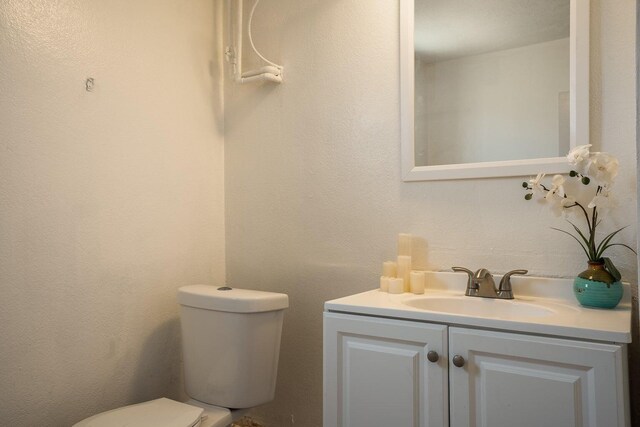 1601 7th St, Moriarty, NM 87035 - bathroom with toilet and vanity
