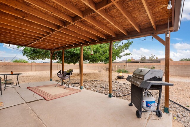 6404 Gambel Quail Rd NE, Rio Rancho, NM 87144 - fenced backyard with area for grilling and a patio area