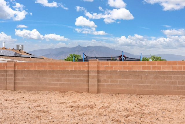 6404 Gambel Quail Rd NE, Rio Rancho, NM 87144 - fenced backyard with a mountain view