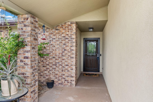 6404 Gambel Quail Rd NE, Rio Rancho, NM 87144 - property entrance featuring stucco siding and brick siding