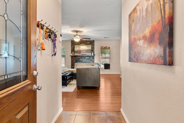 6404 Gambel Quail Rd NE, Rio Rancho, NM 87144 - foyer featuring a ceiling fan, tile patterned flooring, and a textured ceiling