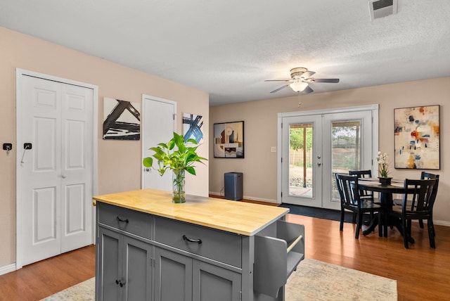 6404 Gambel Quail Rd NE, Rio Rancho, NM 87144 - kitchen featuring gray cabinets, butcher block counters, ceiling fan, light wood-type flooring, and french doors